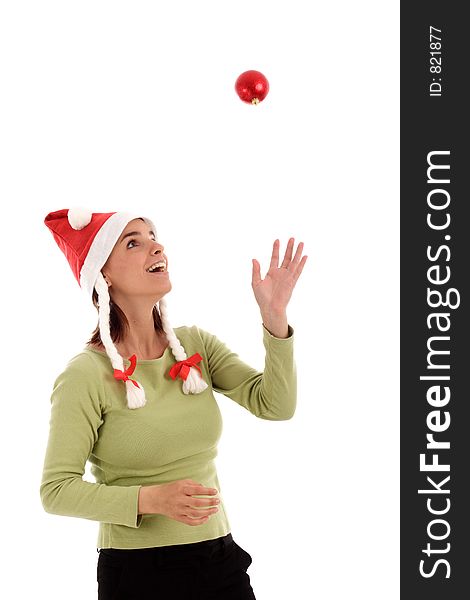 Young woman playing with Christmast tree ornament. Young woman playing with Christmast tree ornament