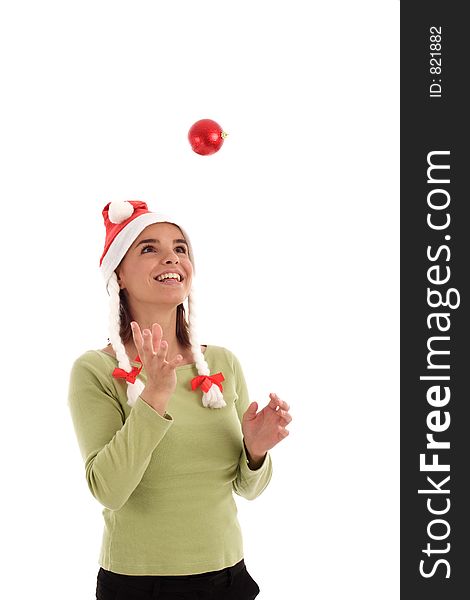 Stock photo of a young woman playing with Christmas ornament (red bauble)