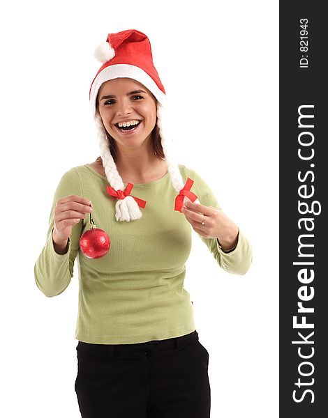 Portrait of a young pretty woman wearing Santa hat, holding red Christmas tree ornament. Portrait of a young pretty woman wearing Santa hat, holding red Christmas tree ornament