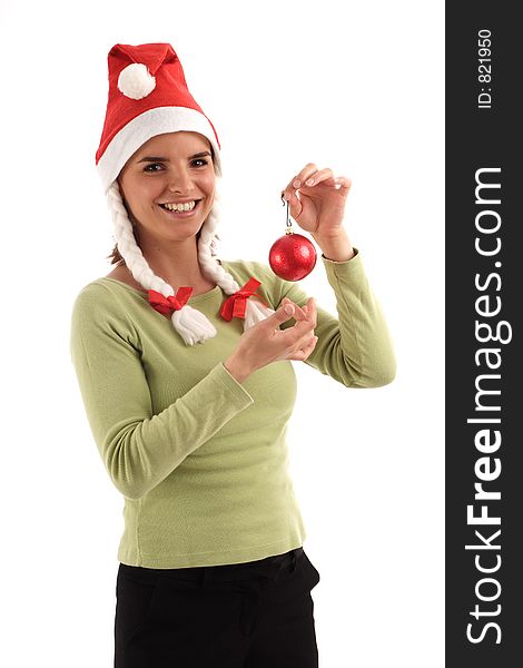 Portrait of a young pretty woman wearing Santa hat, holding red Christmas tree ornament. Portrait of a young pretty woman wearing Santa hat, holding red Christmas tree ornament