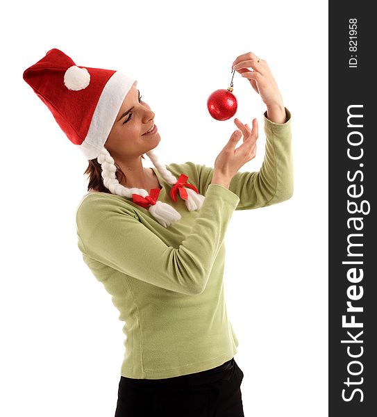 Stock photo of a young woman holidng Christmas ornament (red bauble)