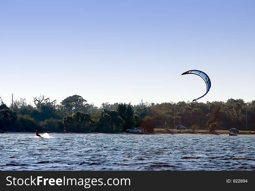 Windsurfer catching some wind. Windsurfer catching some wind