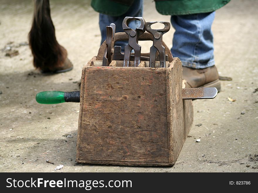 Farriers Tools in their box which are close to the balcksmith and pony. Farriers Tools in their box which are close to the balcksmith and pony