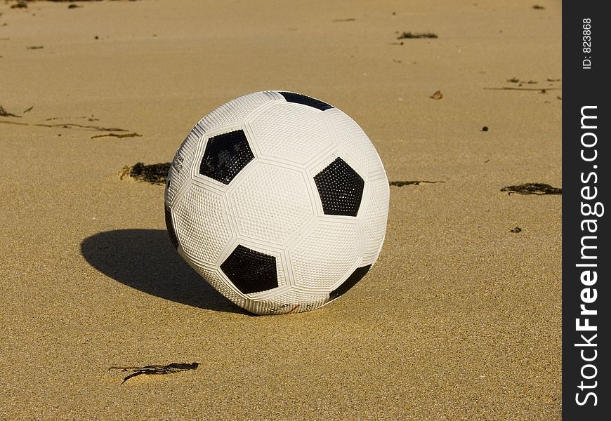 A soccer ball on the beach. A soccer ball on the beach