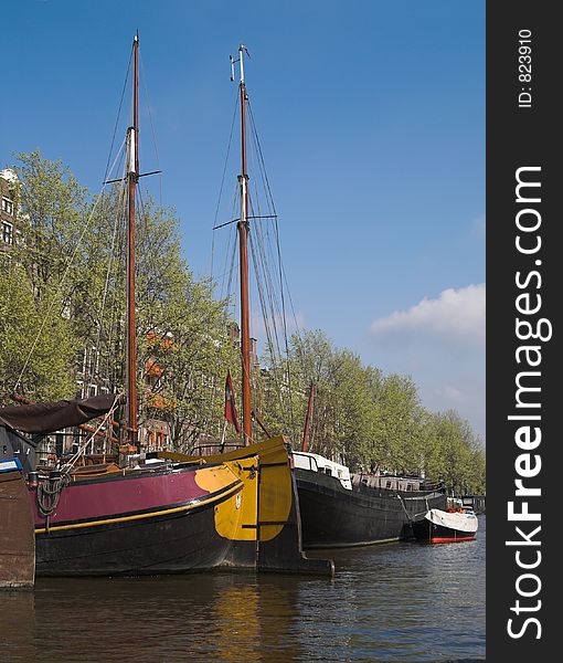 Yachts in city canal, Amsterdam, Netherlands