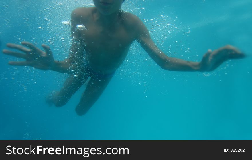 Young boy underwater. Young boy underwater