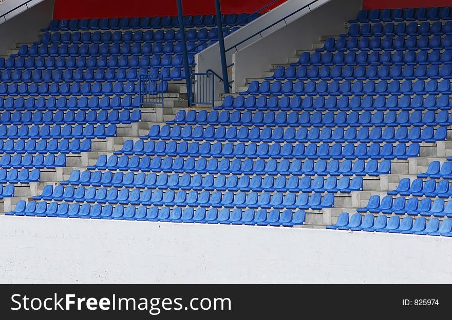 Empty blue football stadium seats, simple and striking. Empty blue football stadium seats, simple and striking