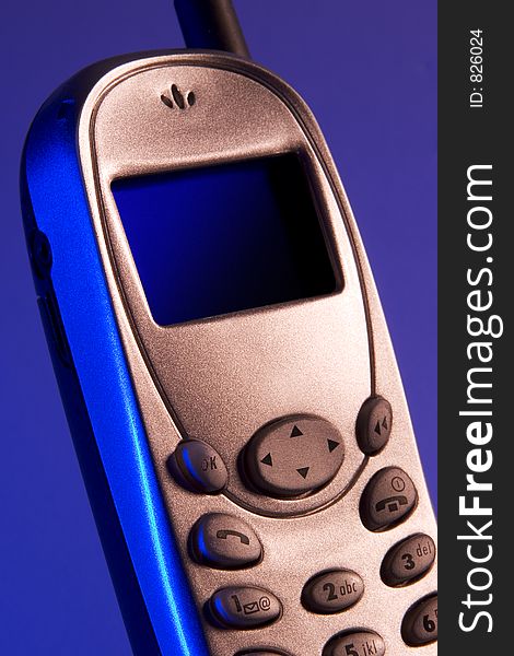 Cellular phone on blue background