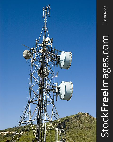 A lot of antennas mounted on a huge pylon. A lot of antennas mounted on a huge pylon