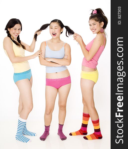 Three young women in colorful clothing. Three young women in colorful clothing