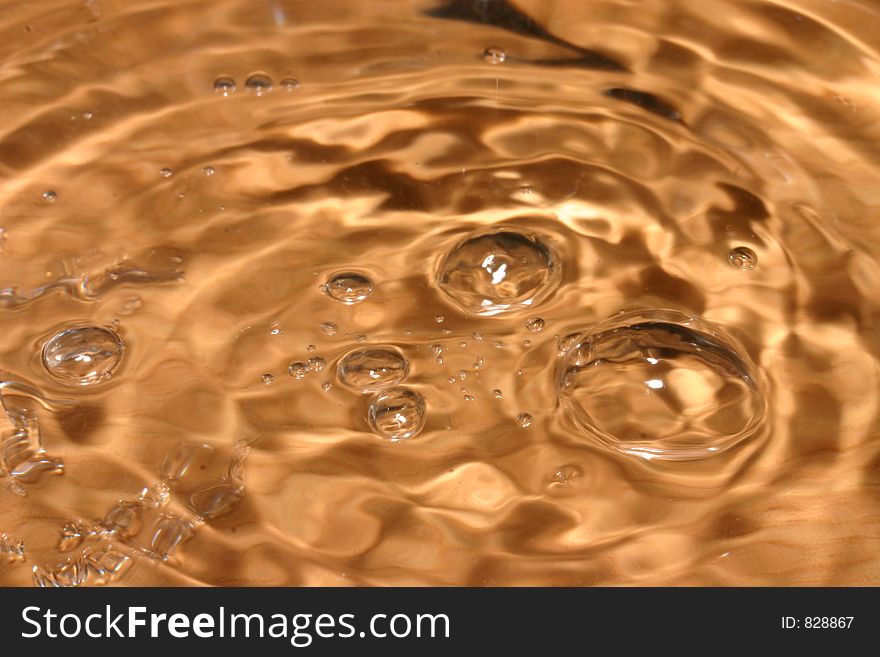 Bubbles in colored water on a brown background. Bubbles in colored water on a brown background