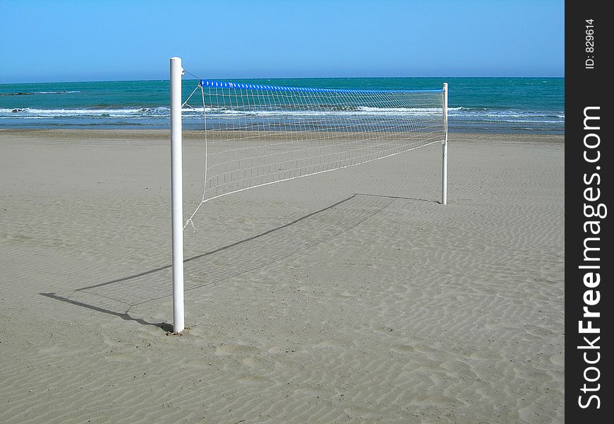 Isolated net of volleyball in a beach. Isolated net of volleyball in a beach