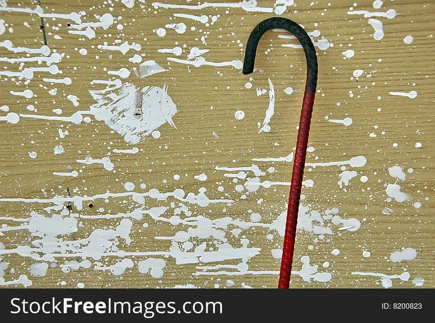 Red rod hook on a painted background