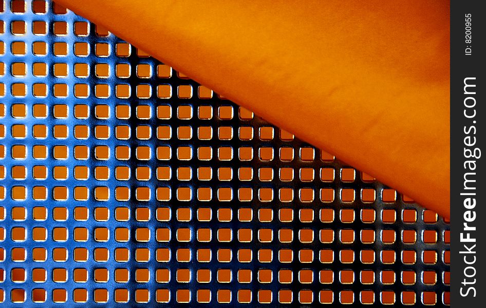 Regular metallic net with orange background