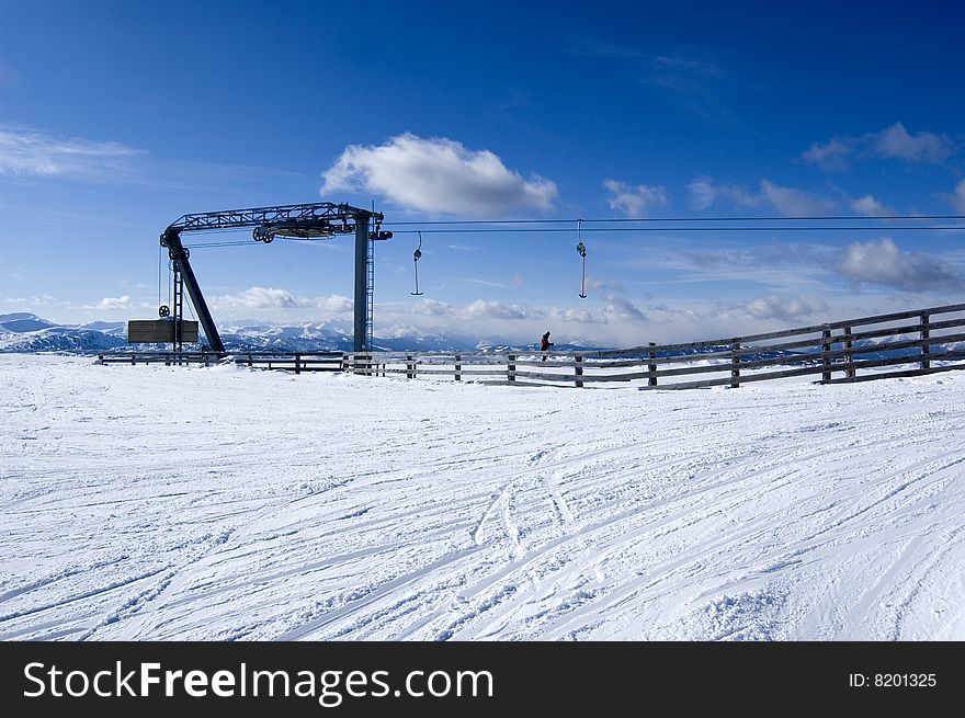 Ski lift in alps with blue sky