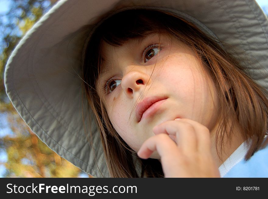 Portrait of girl in hat with wide brim