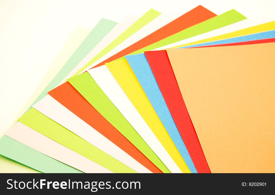 Colorful fan made of papers, isolated over white background. Colorful fan made of papers, isolated over white background.
