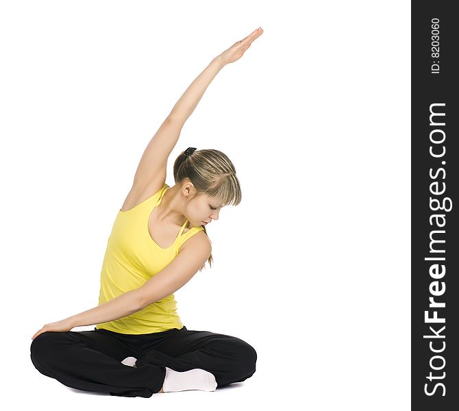 Fitness girl stretching. Isolated on white