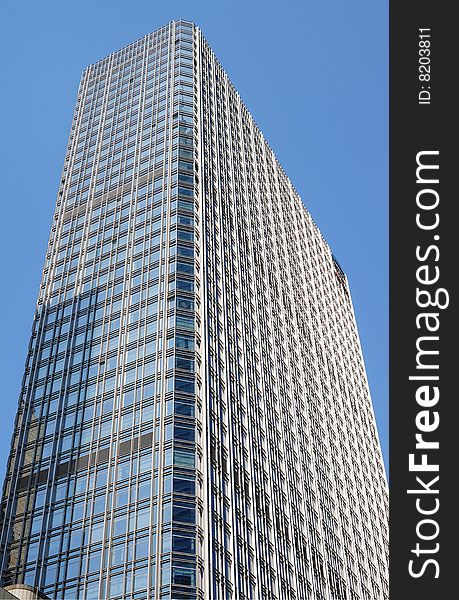 Modern office building against blue sky