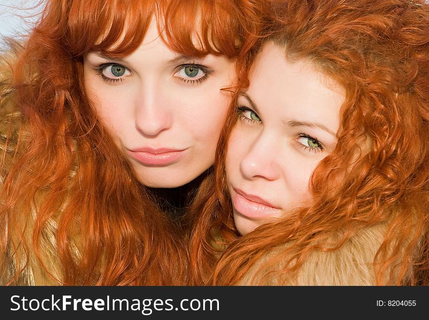Two beautiful red hair girls closeup. Two beautiful red hair girls closeup