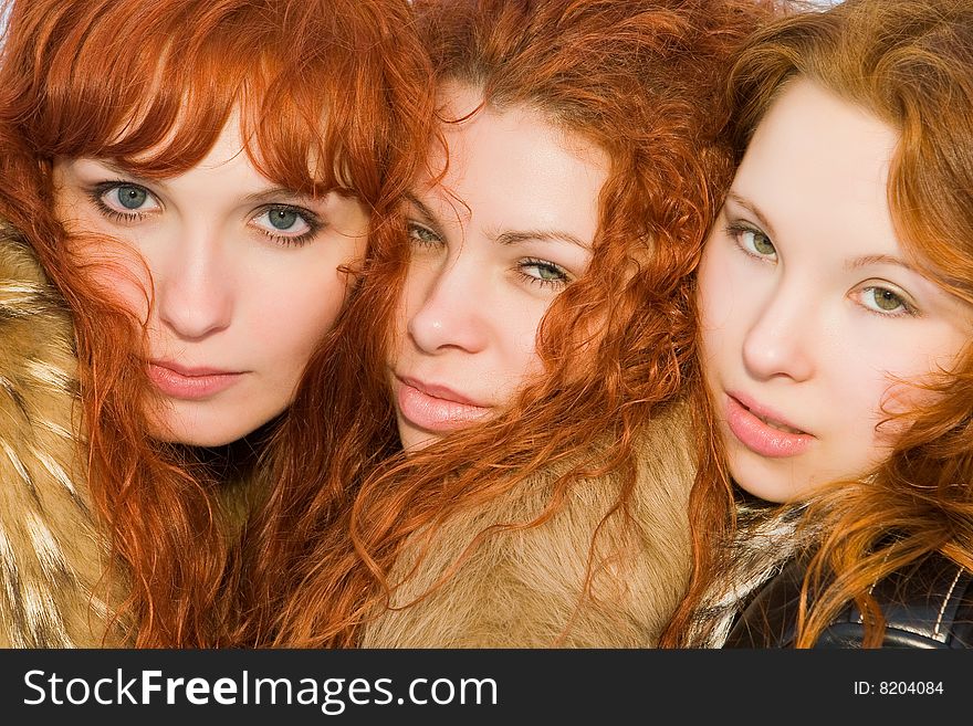 Three beautiful red hair girls closeup. Three beautiful red hair girls closeup
