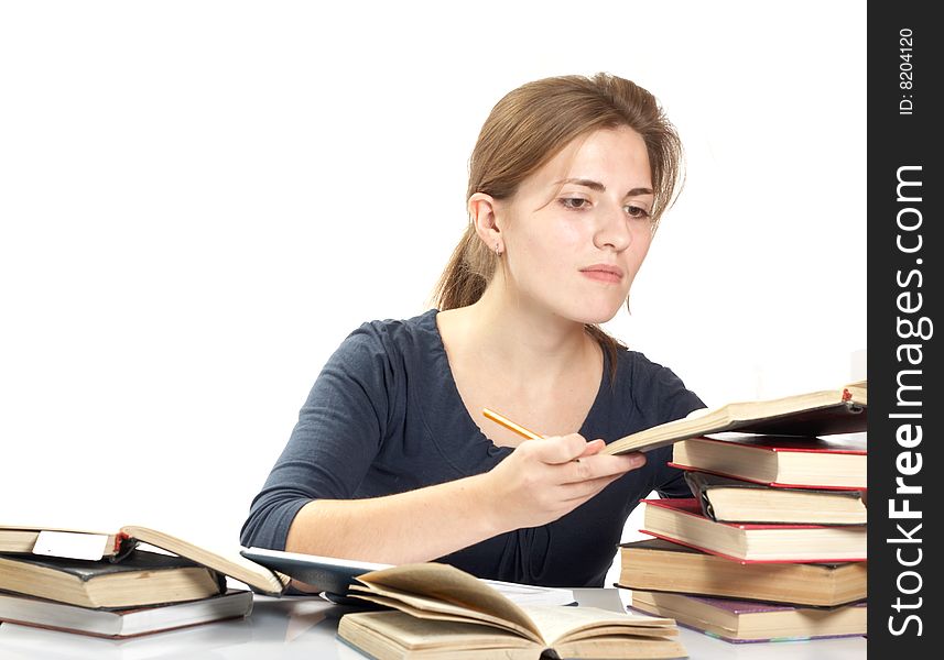 Young woman and a pile of books
