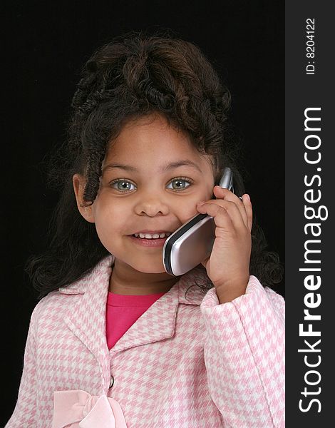 Adorable five year old business woman on cellphone. Adorable five year old business woman on cellphone.