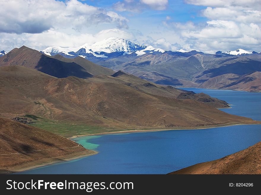 Snowy mountains and blue river in tibet