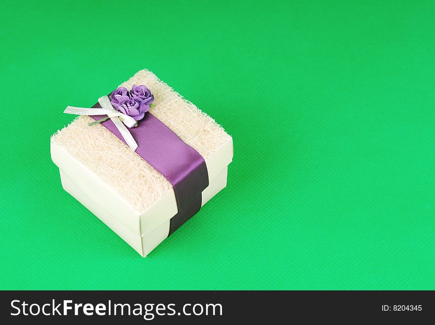 A gift box on green background