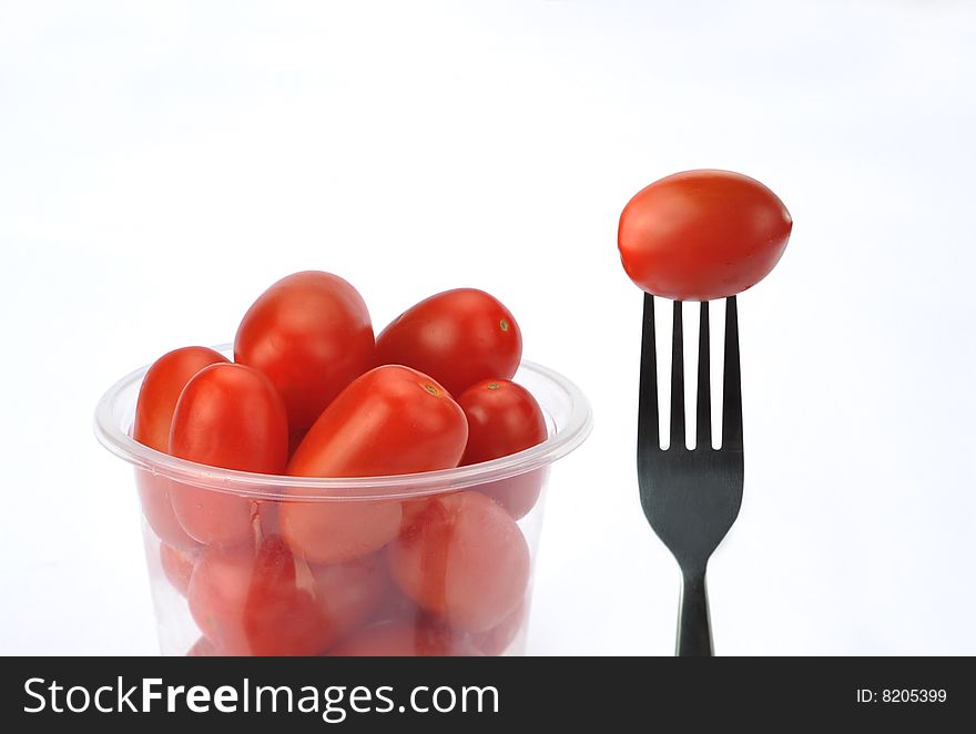 Plum tomatoes on white background. Plum tomatoes on white background.