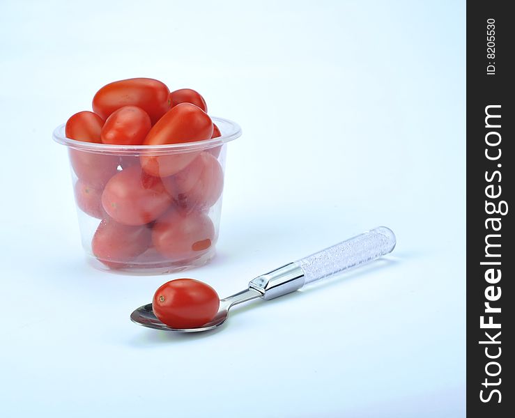 Plum tomatoes on white background. Plum tomatoes on white background.