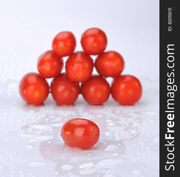 Small tomatoes in a white background