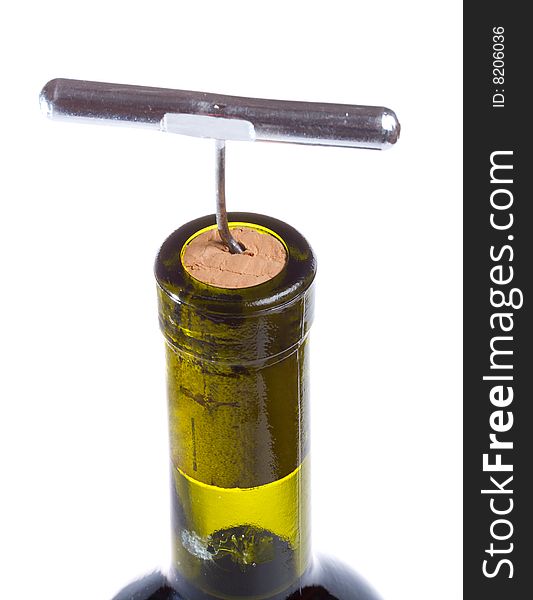 Close-up corkscrew in wine bottle