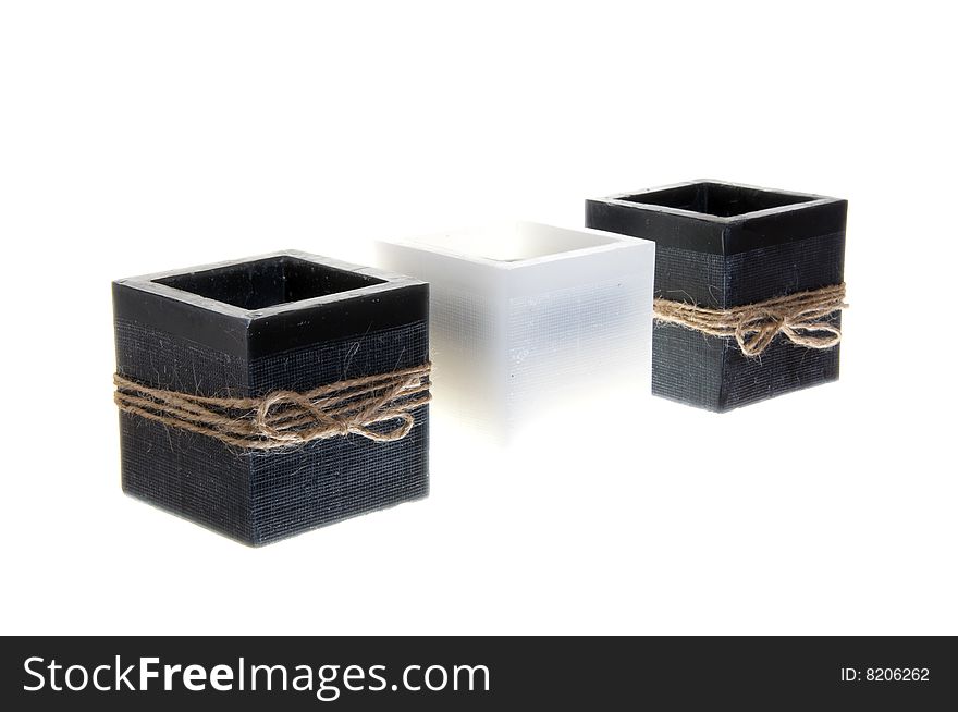 Closeup to three candlesticks isolated on white background.