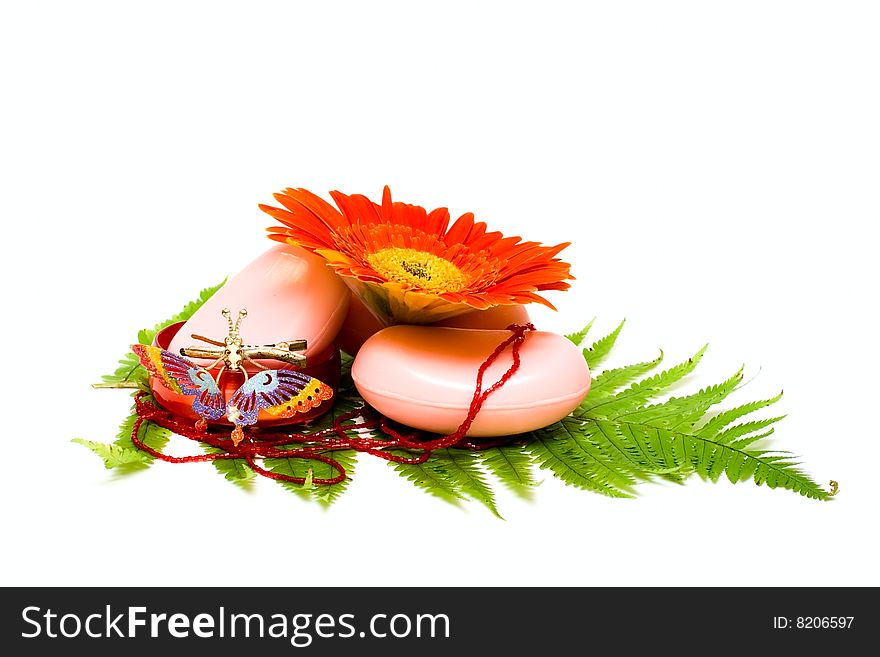 Soap and flower isolated on white