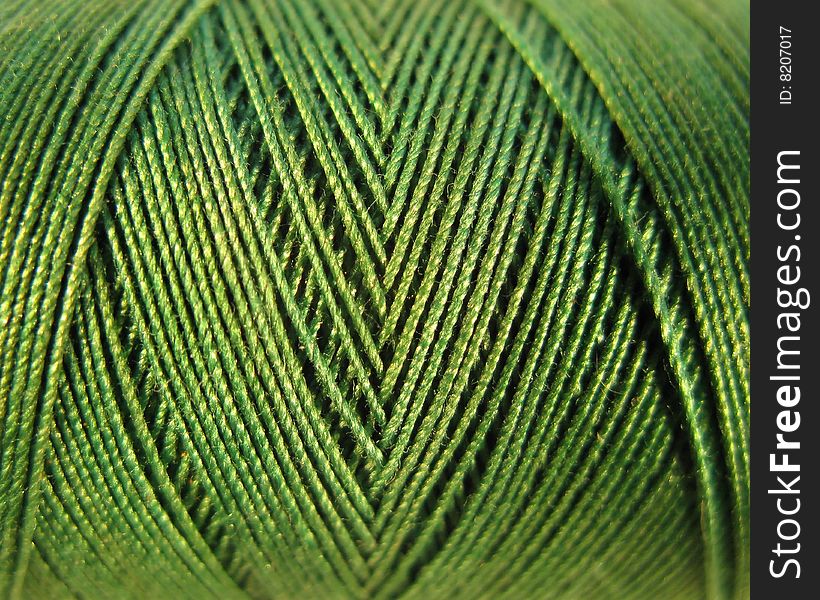 A close up of a green spool good for texture