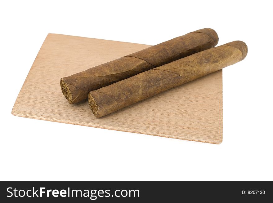 Two cigars isolated on white
