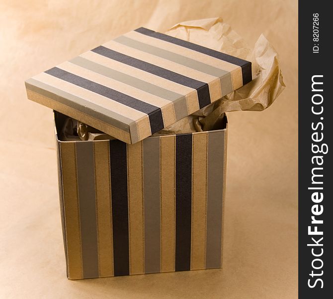 Open gift box with craft paper inside