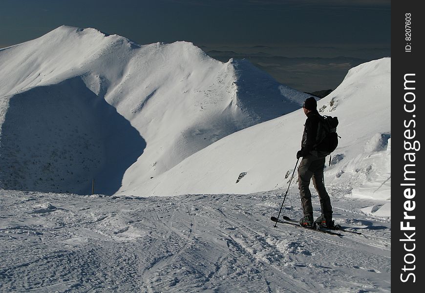 Skier on snowy high mountains. Skier on snowy high mountains