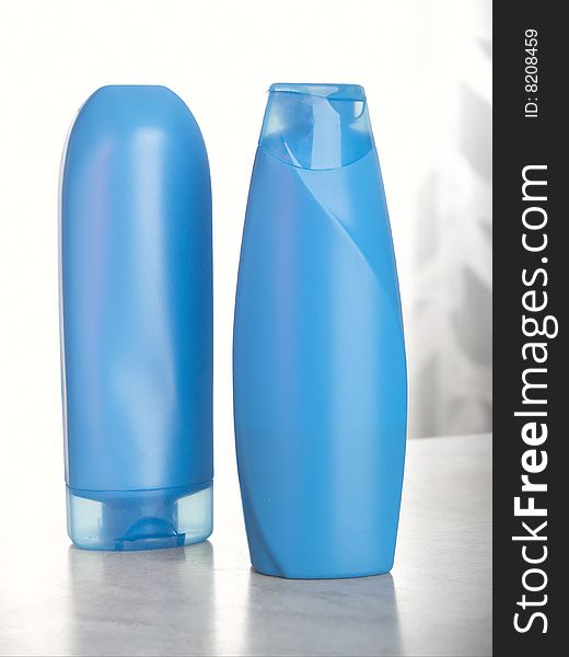 two bottle with perfumery dark blue colour