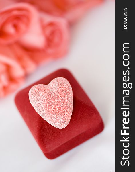 Sugar heart over gift box. Shallow depth of field.