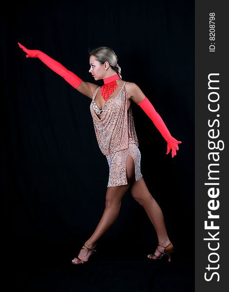 Blondie girl latin dancer against black background