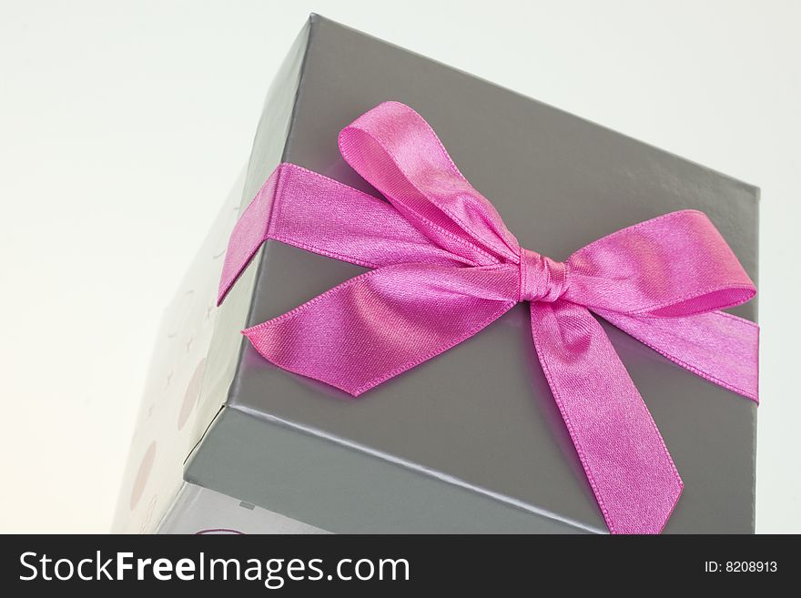 Gray gift box, isolated on white, with bow