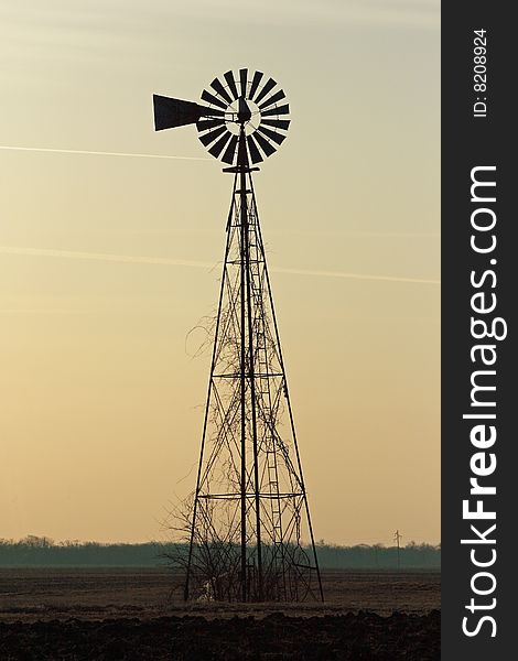 Prairie windmill at sunrise