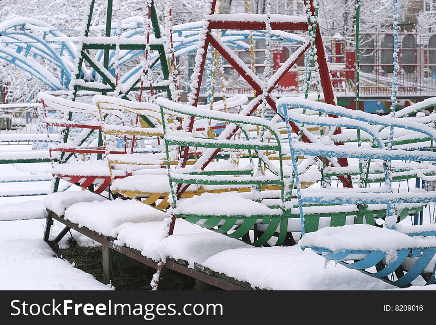 Winter park scene with snowy fun boats