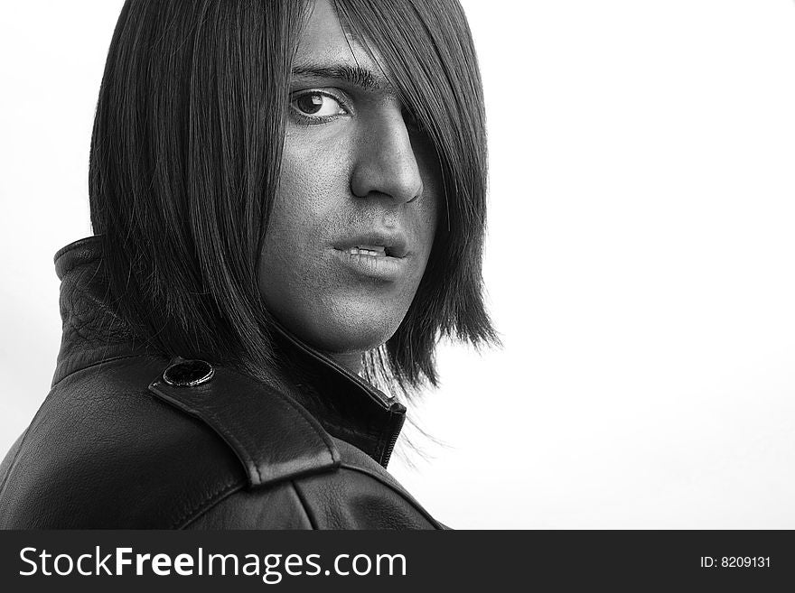 Young handsome man with long brunette hair on white background. Young handsome man with long brunette hair on white background