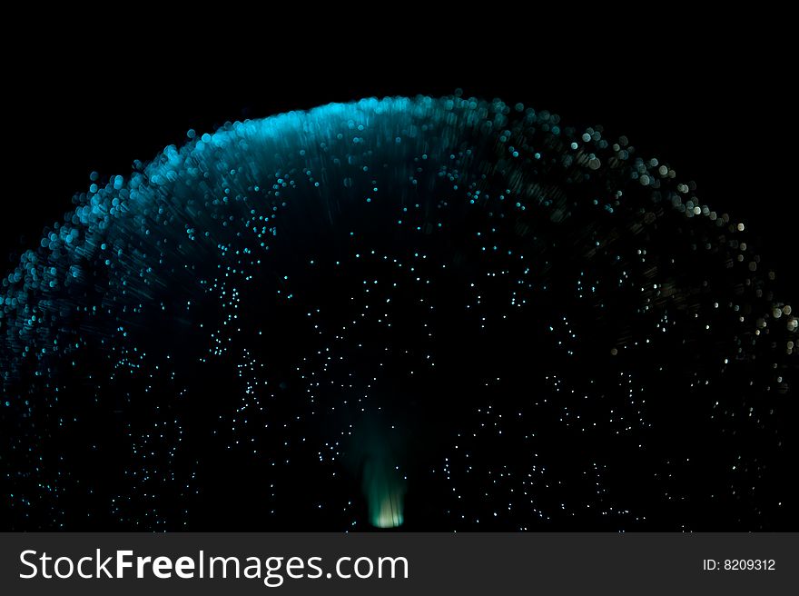 Blue colored top of a fiber glass lamp on a black background. Blue colored top of a fiber glass lamp on a black background