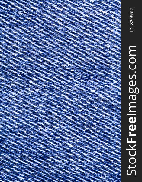 A close-up of the texture of blue jeans fabric. A close-up of the texture of blue jeans fabric