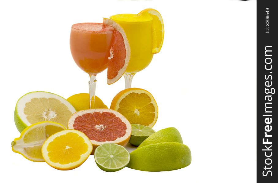 Glasses juice and citrus on a white background. Glasses juice and citrus on a white background