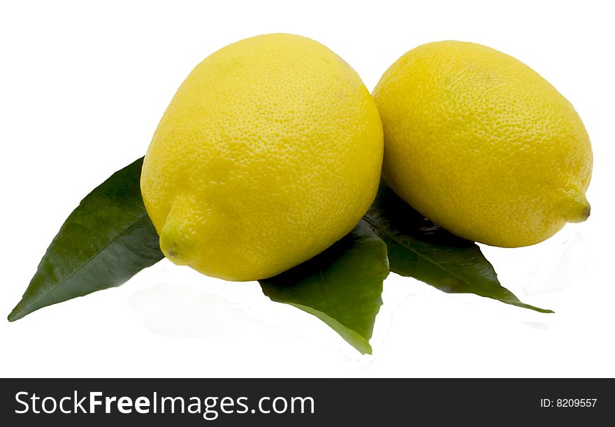 Lemons and green sheet isolated on the white